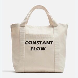 Zara’s Beige Tote Bag with Black Text